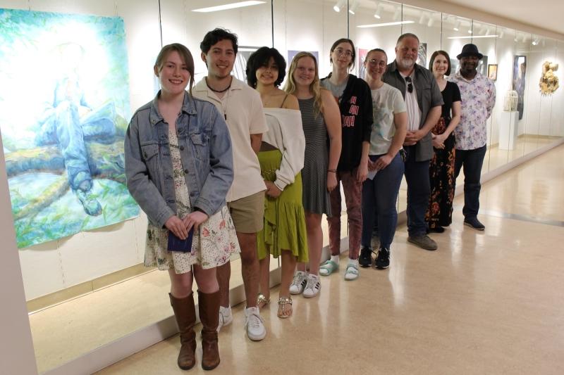 9 people standing in front of ArtSpace Gallery