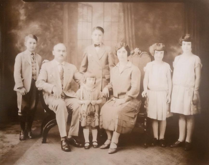 early 1900s sepia tone photo of Peter & Helen Watson with their 5 children